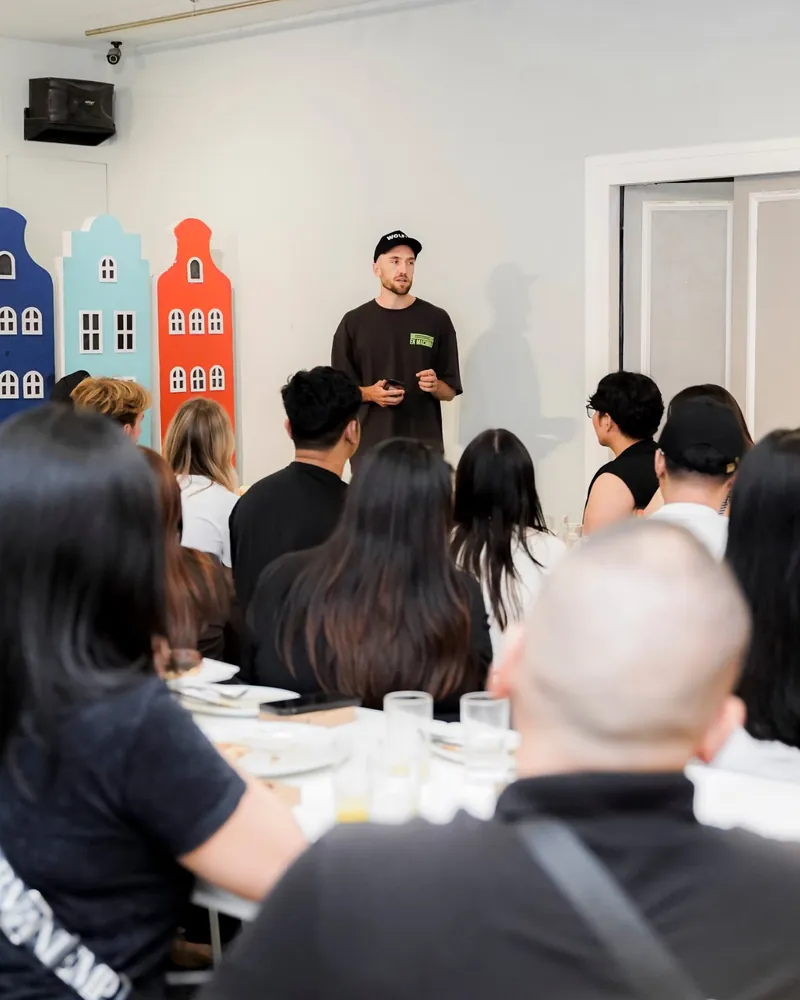 Andy Crebar speaking to a full room at a Wolf IQ team event